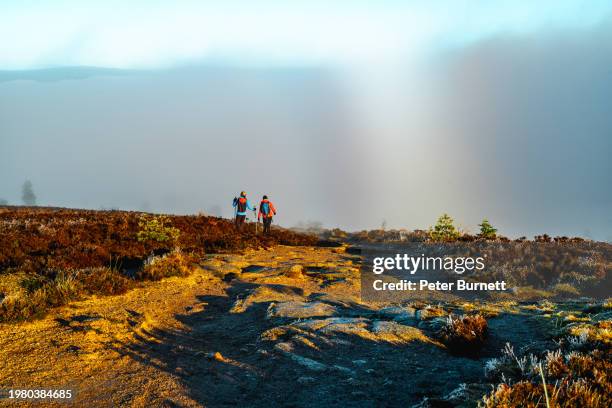 hiking on bennachie hill, inverurie, scotland - two people stock pictures, royalty-free photos & images