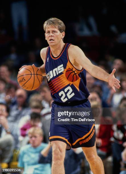 Danny Ainge, Shooting Guard and Point Guard for the Phoenix Suns dribbles the basketball down court during the NBA Midwest Division basketball game...