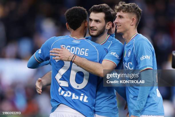 Napoli's forward Khvicha Kvaratskhelia celebrates with teammates Cyril Ngonge and Jesper Lindstrom at the end of the Serie A football match between...