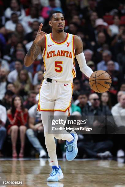 Dejounte Murray of the Atlanta Hawks dribbles the ball against the Miami Heat during the second quarter of the game at Kaseya Center on January 19,...