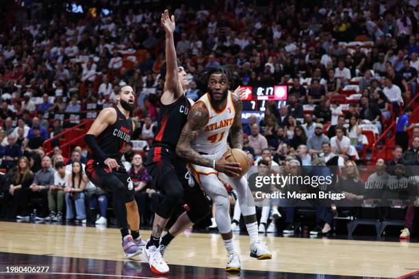 Saddiq Bey of the Atlanta Hawks drives against Tyler Herro of the Miami Heat during the first quarter at Kaseya Center on January 19, 2024 in Miami,...