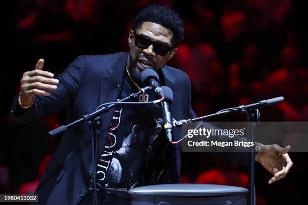 Former Miami Heat player Udonis Haslem addresses the crowd during his jersey retirement ceremony at halftime of a game between the Atlanta Hawks and...