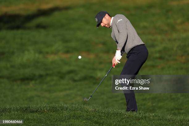 Former NFL player Alex Smith plays a shot during the second round of the AT&T Pebble Beach Pro-Am at Pebble Beach Golf Links on February 02, 2024 in...