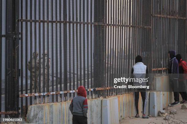 Egyptian army soldiers patrol the border wall with Egypt in Rafah, Gaza Strip, on Thursday. Feb. 1, 2024. Negotiations are advancing for an agreement...