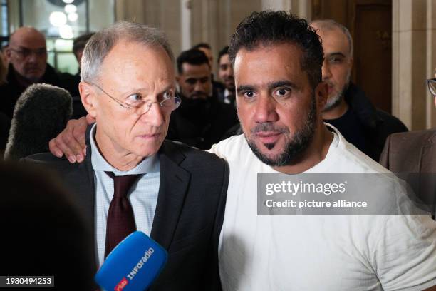 February 2024, Berlin: The main defendant Arafat Abou-Chaker puts his hand on the shoulder of his lawyer Hansgeorg Birkhoff after the verdict was...