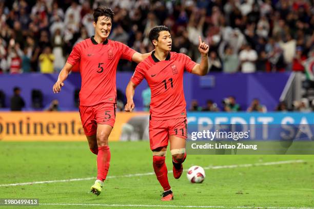 Hwang Hee-chan of South Korea celebrates his penalty with Park Yong-woo of South Korea during the AFC Asian Cup quarter final match between Australia...