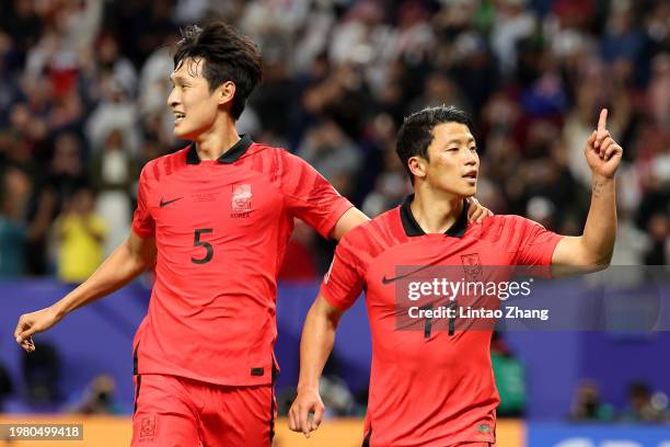 Hwang Hee-chan of South Korea celebrates his penalty with Park Yong-woo of South Korea during the AFC Asian Cup quarter final match between Australia...