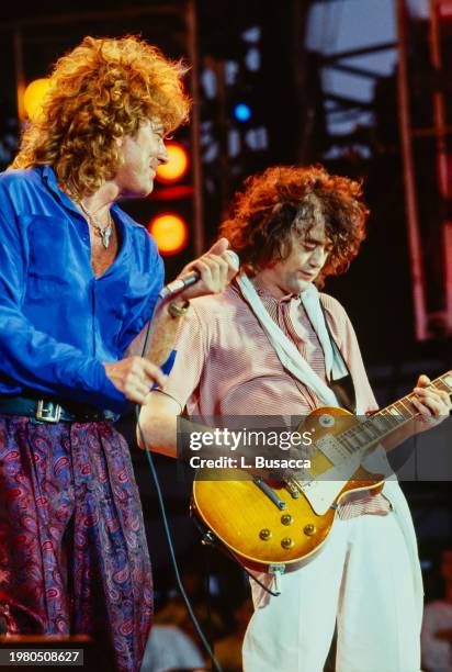 British songwriter and singer Robert Plant and British songwriter and guitarist Jimmy Page of the British rock band Led Zeppelin perform during Live...