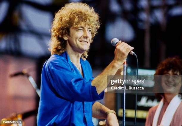 British songwriter and singer Robert Plant and British songwriter and guitarist Jimmy Page of the British rock band Led Zeppelin perform during Live...