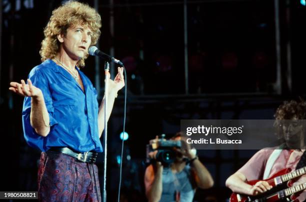 British songwriter and singer Robert Plant and British songwriter and guitarist Jimmy Page of the British rock band Led Zeppelin perform during Live...
