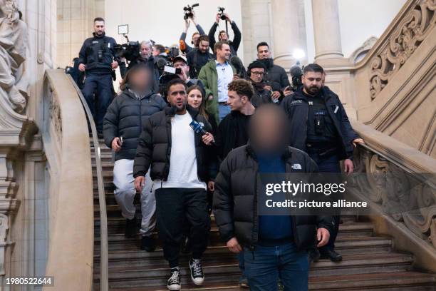 February 2024, Berlin: The main defendant Arafat Abou-Chaker leaves the district court surrounded by journalists after the verdict was announced in...