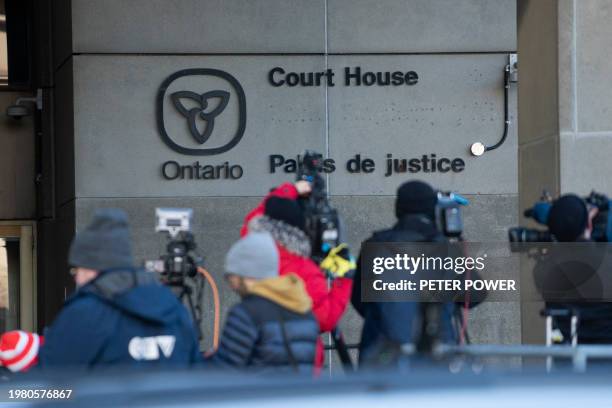 Members of the press report outside of the Ontario Court of Justice, in London, Ontario on February 5, 2024. Five former Canadian world junior hockey...
