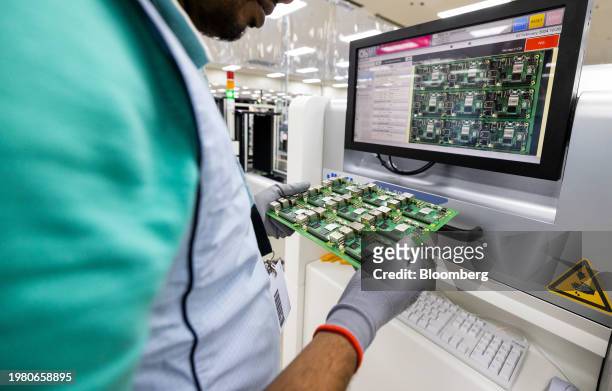 An employee performs quality control checks on Raspberry Pi personal computer on the production line at the Sony UK Technology Centre in Pencoed, UK,...