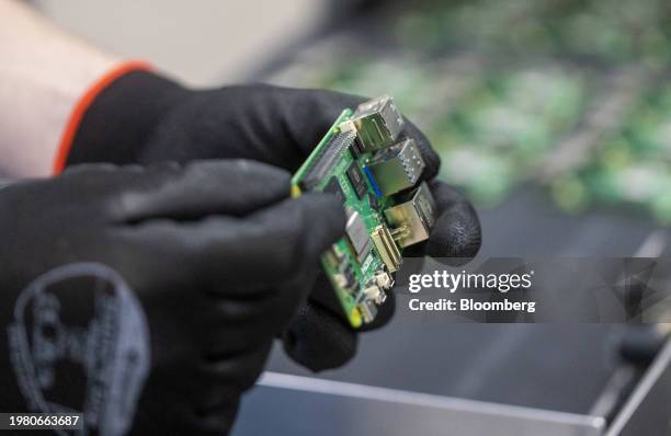 An employee performs quality control checks on Raspberry Pi personal computers on the production line at the Sony UK Technology Centre in Pencoed,...