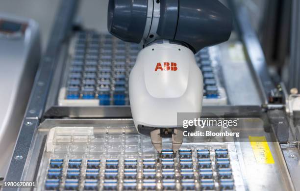 An ABB Ltd. Robot collects a component to be placed on a Raspberry Pi personal computer on the production line at the Sony UK Technology Centre in...