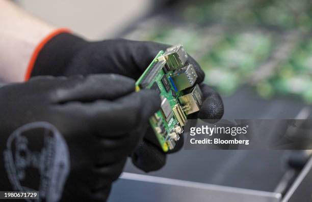 An employee performs quality control checks on Raspberry Pi personal computers on the production line at the Sony UK Technology Centre in Pencoed,...