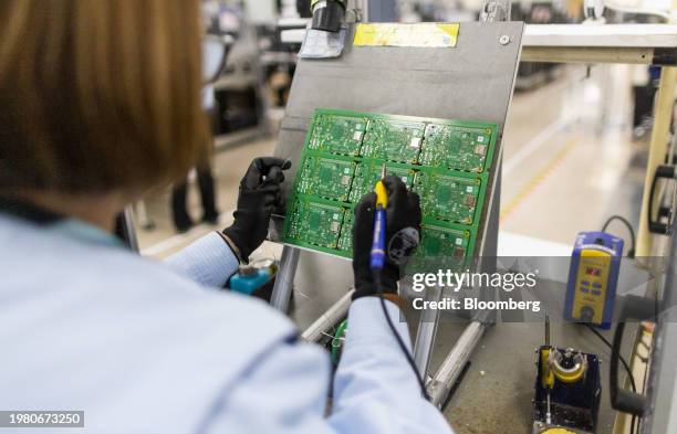 An employee performs quality control checks on Raspberry Pi personal computers on the production line at the Sony UK Technology Centre in Pencoed,...