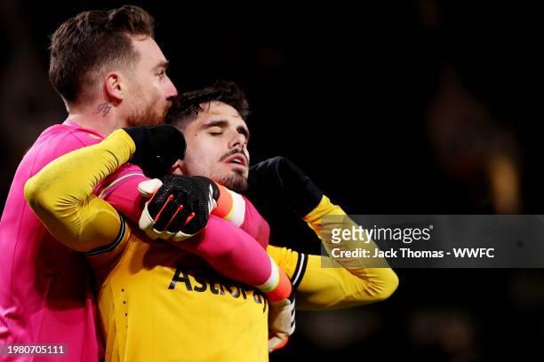 Pedro Neto of Wolverhampton Wanderers celebrates after scoring his team's third goal with Jose Sa during the Premier League match between...