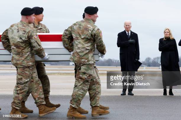 President Joe Biden and U.S. First lady Jill Biden watch as a U.S. Army carry team moves a flagged draped transfer case containing the remains of...