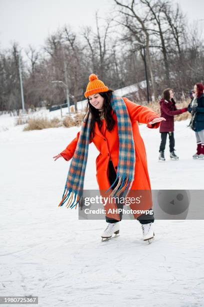 winter skating moments: candid moment of winter skating adventure - teens winter sport stock pictures, royalty-free photos & images