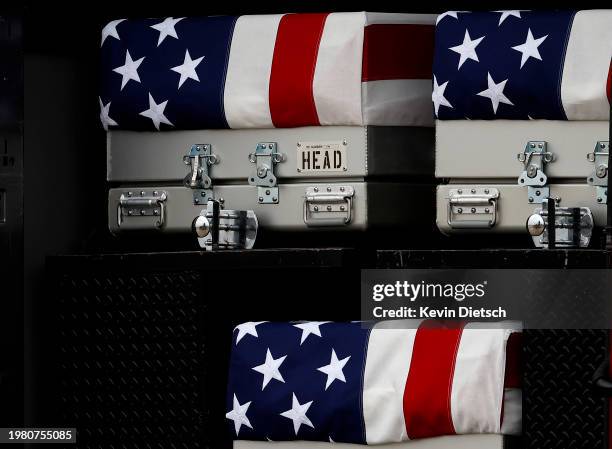 The flag draped transfer cases containing the remains of fallen service members U.S. Army Sgt. William Rivers, Sgt. Breonna Moffett and Sgt. Kennedy...