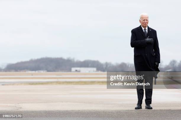 President Joe Biden places his hand over his heart during the dignified transfer for fallen service members U.S. Army Sgt. William Rivers, Sgt....