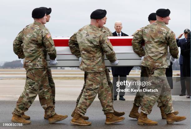 President Joe Biden pays his respects as a U.S. Army carry team moves a flagged draped transfer case containing the remains of Army Sgt. William...