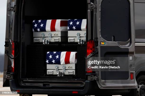 The flag draped transfer cases containing the remains of fallen service members U.S. Army Sgt. William Rivers, Sgt. Breonna Moffett and Sgt. Kennedy...