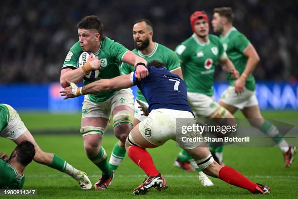 Joe McCarthy of Ireland is tackled by Charles Ollivon of France during the Guinness Six Nations 2024 match between France and Ireland at Orange...