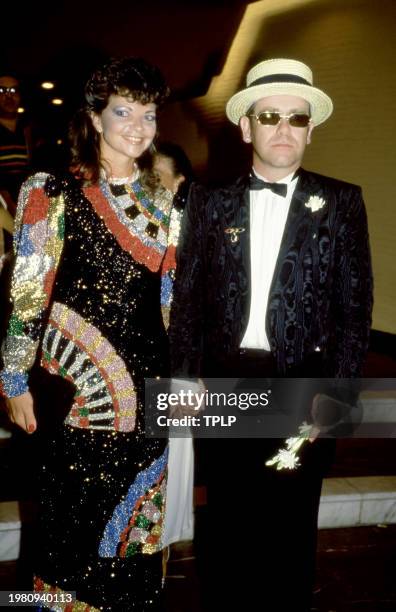 German recording engineer Renate Blauel and her husband, British musician Elton John, attend the Red Cross Ball for Prince Rainier at the Monaco...