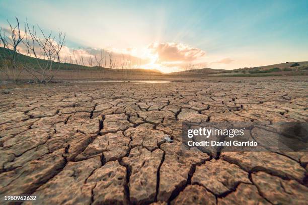 drought impact, dry reservoir under the sequelae of drought. - dehydration stock pictures, royalty-free photos & images