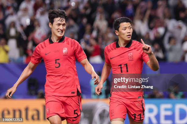 Hwang Hee-chan of South Korea celebrates his penalty with Park Yong-woo of South Korea during the AFC Asian Cup quarter final match between Australia...