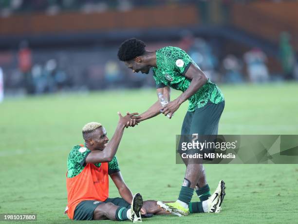 Victor Osimhen of Nigeria and Ola Aina celebrate the TotalEnergies CAF Africa Cup of Nations quarterfinal match between Nigeria and Angola at Stade...