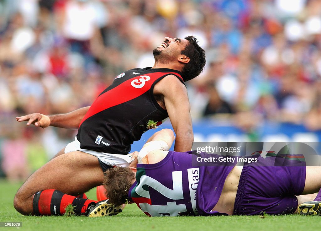 Essendon Rioli Dean Rioli for the Bombers injures his leg after being tackled by ...