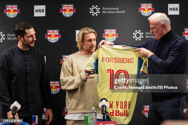 New York Red Bulls designated player Emil Forsberg is presented with his jersey by head of sport Jochen Schneider and head coach Sandro Schwarz...