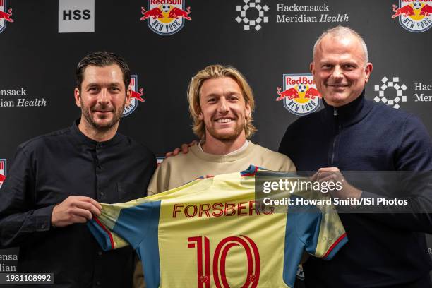 New York Red Bulls designated player Emil Forsberg is presented with his jersey by head of sport Jochen Schneider and head coach Sandro Schwarz...