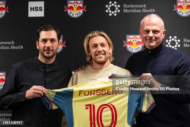 New York Red Bulls designated player Emil Forsberg is presented with his jersey by head of sport Jochen Schneider and head coach Sandro Schwarz...