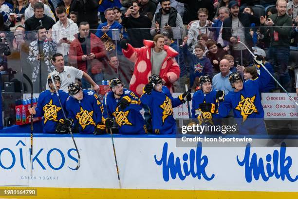 Team Matthews Celebrity captain Justin Bieber and the player's bench celebrate a goal during the 2024 NHL All-Star game at Scotiabank Arena on...