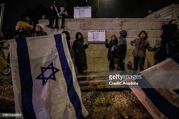 Far-right Israelis, holding Israeli flags and banners, gather in front of the United Nations Relief and Works Agency for Palestine Refugees in the...