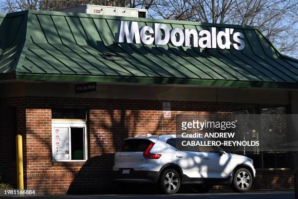 Car stands at a drive-through at a McDonald's in McLean, Virginia, on February 5, 2024. McDonald's reported higher quarterly profits Monday, although...