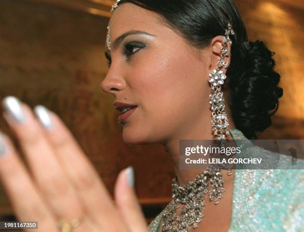 Lara Dutta, Miss India 2000, chats with guests of a National Gifts Auction 02 May 2000 in Nicosia. Each of the 79 Miss Universe delegates contributed...