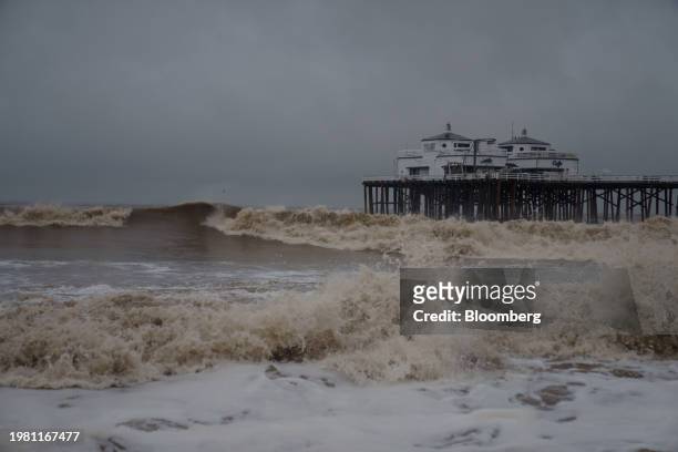 Waves crash on rocks near the Malibu Pier during a storm in Malibu, California, US, on Monday, Feb. 5, 2024. Los Angeles and the wealthy enclaves of...
