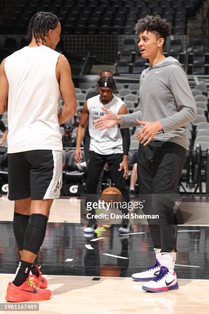 Assistant Coach Candice Dupree of the San Antonio Spurs warms up with Tre Jones before the game against the Portland Trail Blazers on January 6, 2024...