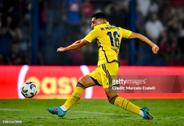 Miguel Merentiel of Boca Juniors kicks the ball to score the team's first goal during a Copa de la Liga 2024 group B match between Tigre and Boca...