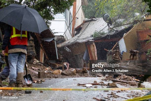 Los Angeles, CA A So Cal Gas worker investigates a Beverly Crest home that was pushed off it's foundation by a mudslide early Monday morning on...