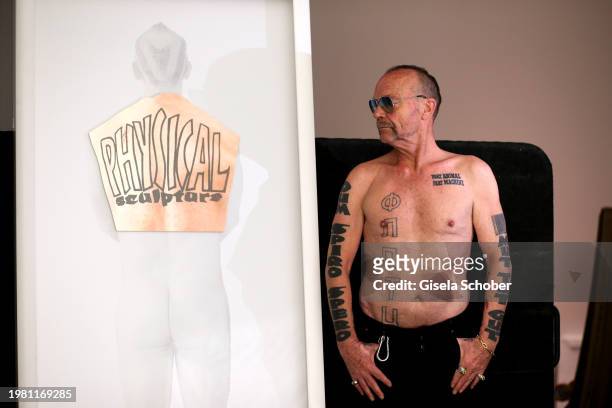 Artist Wolfgang Flatz poses at his "Haut - Back Piece" prior his exhibition "Something wrong with physical sculpture" at Pinakothek der Moderne on...