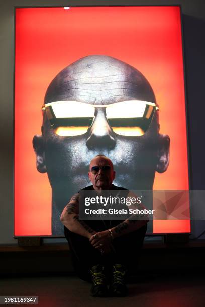 Artist Wolfgang Flatz poses at his "Golden Mastercard" portrait prior his exhibition "Something wrong with physical sculpture" at Pinakothek der...