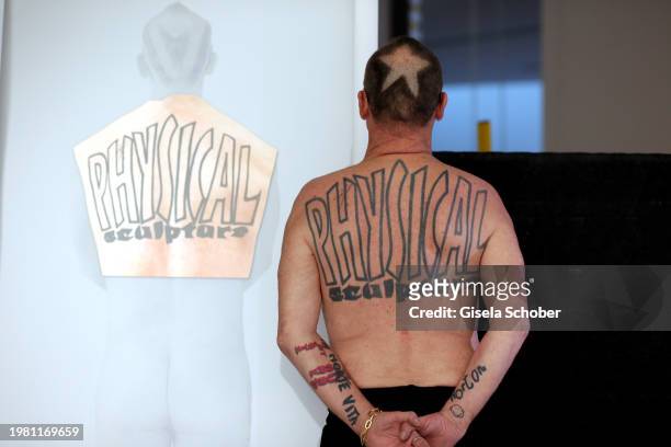 Artist Wolfgang Flatz poses at his "Haut - Back Piece" prior his exhibition "Something wrong with physical sculpture" at Pinakothek der Moderne on...