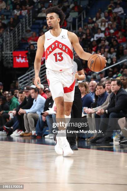 Jordan Nwora of the Toronto Raptors dribbles the ball during the game against the New Orleans Pelicans on February 5, 2024 at the Smoothie King...