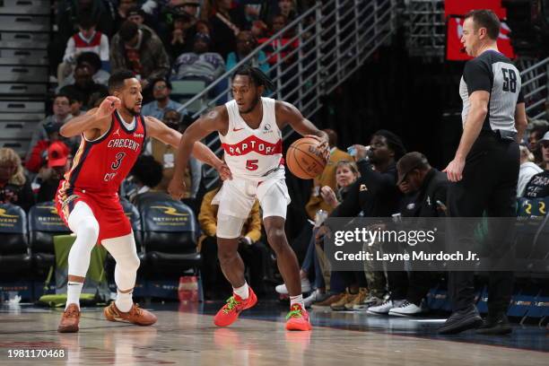 Immanuel Quickley of the Toronto Raptors handles the ball against CJ McCollum of the New Orleans Pelicans during the game on February 5, 2024 at the...